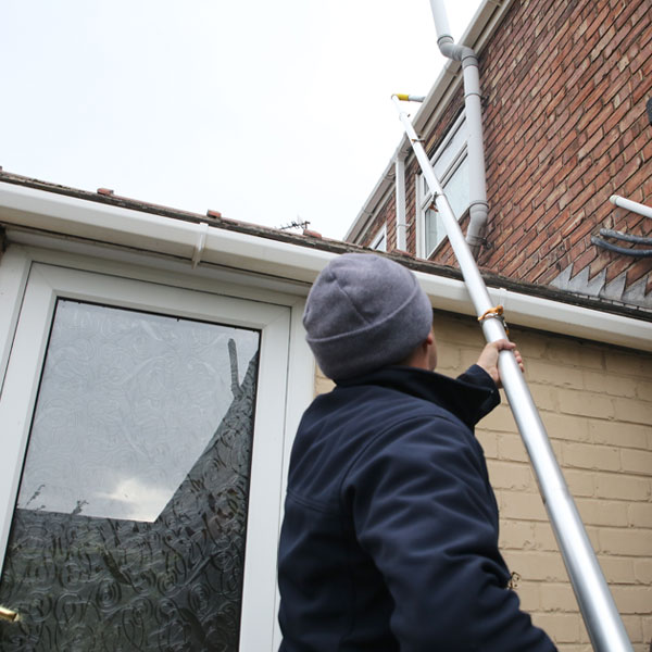 Long reach pole can clean gutters above outbuildings.