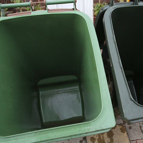 Inside of wheelie bins after being cleaned.