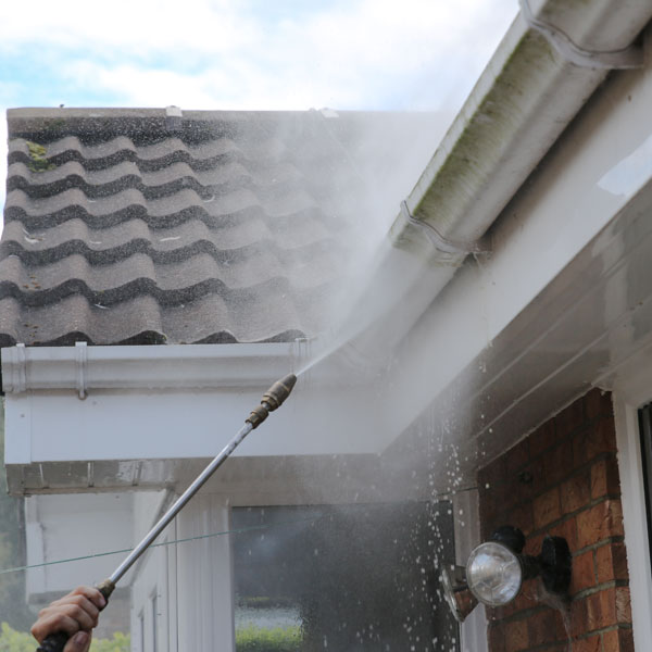 Gutters and fascias being spray cleaned.