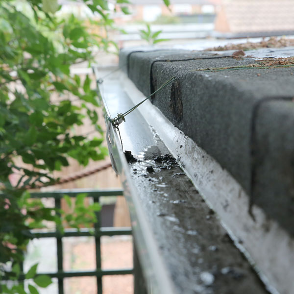 Comparison of spray cleaned and non spray cleaned areas of gutter.